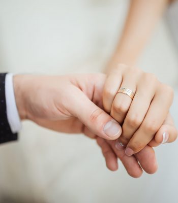 Wedding moments. Newly wed couple's hands with wedding rings