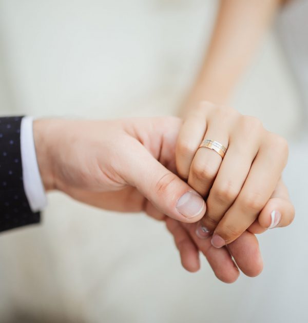 Wedding moments. Newly wed couple's hands with wedding rings